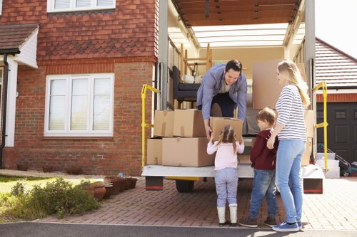 Packed boxes and furniture ready for a house move in Stanmore