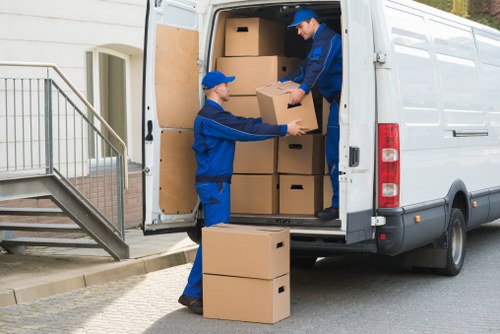 Professional movers handling household belongings