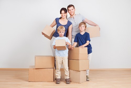 Packed moving boxes and furniture ready for transport