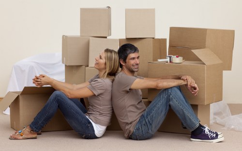 Organised unpacking service placing items into rooms at a Stanmore property