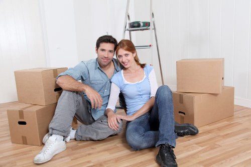 Removalists carrying household furniture from a terrace home in Stanmore